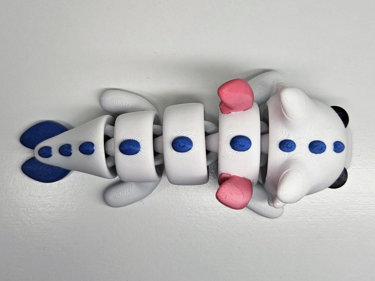 Medium Sized Flexible Dragon with Wings In White, Blue & Pink. Articulated Fidget Animal
