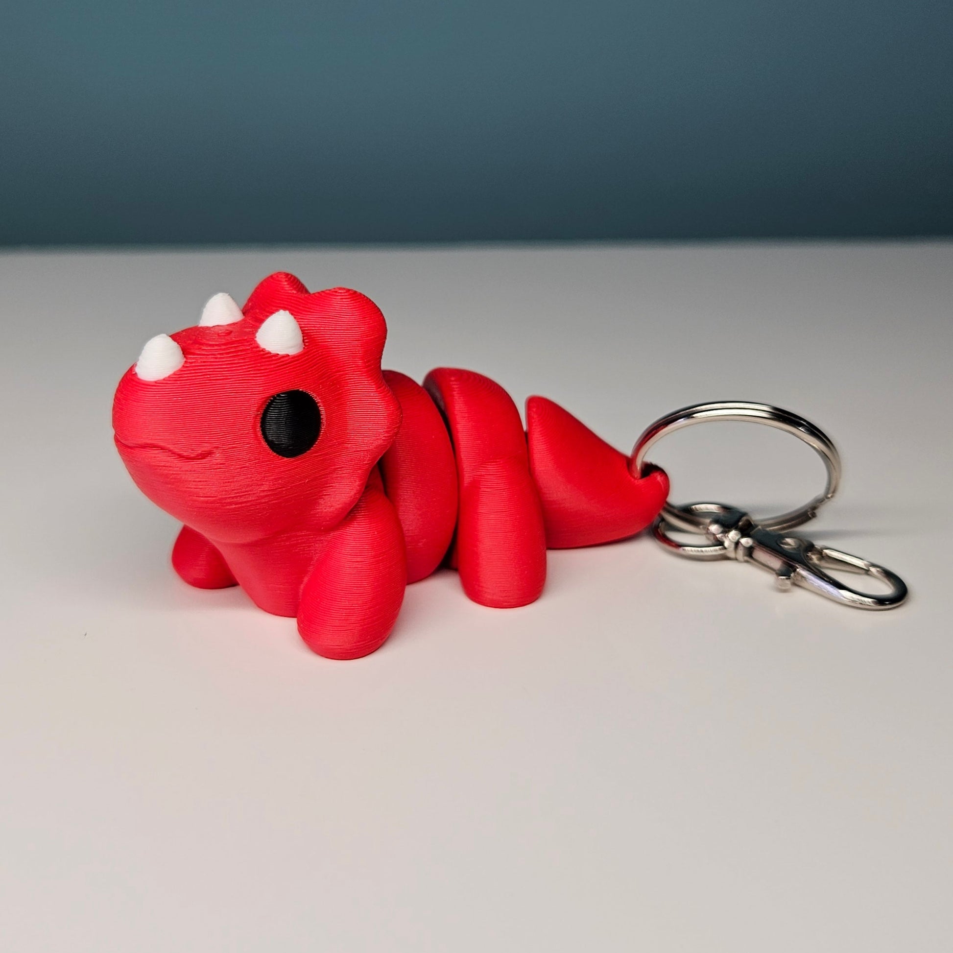 Triceratops Keyring / Key Chain in Red. Articulated Fidget Animal by Flexymals.co.uk