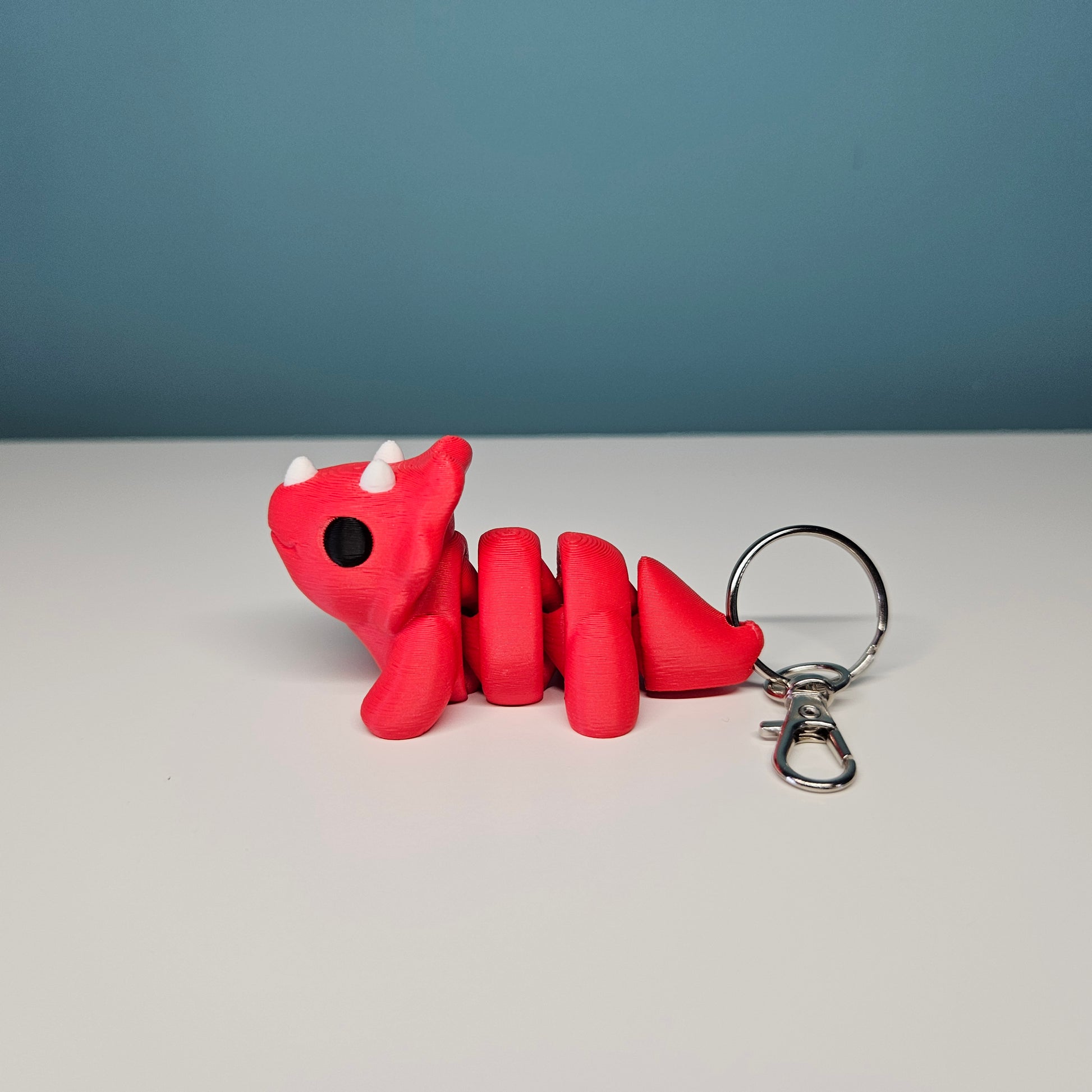 Triceratops Keyring / Key Chain in Red. Articulated Fidget Animal by Flexymals.co.uk