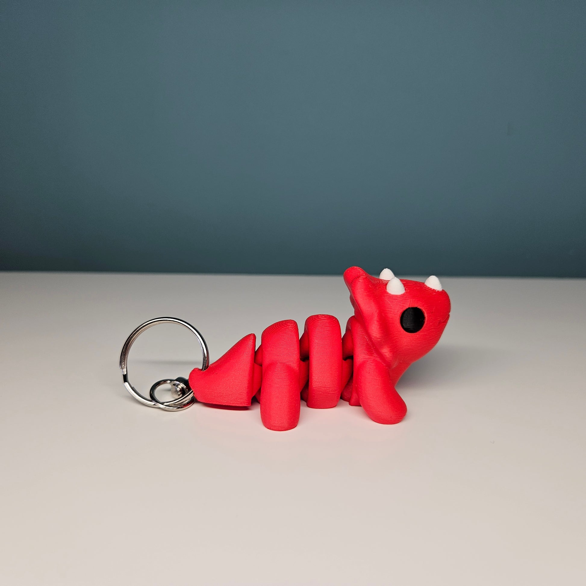 Triceratops Keyring / Key Chain in Red. Articulated Fidget Animal by Flexymals.co.uk