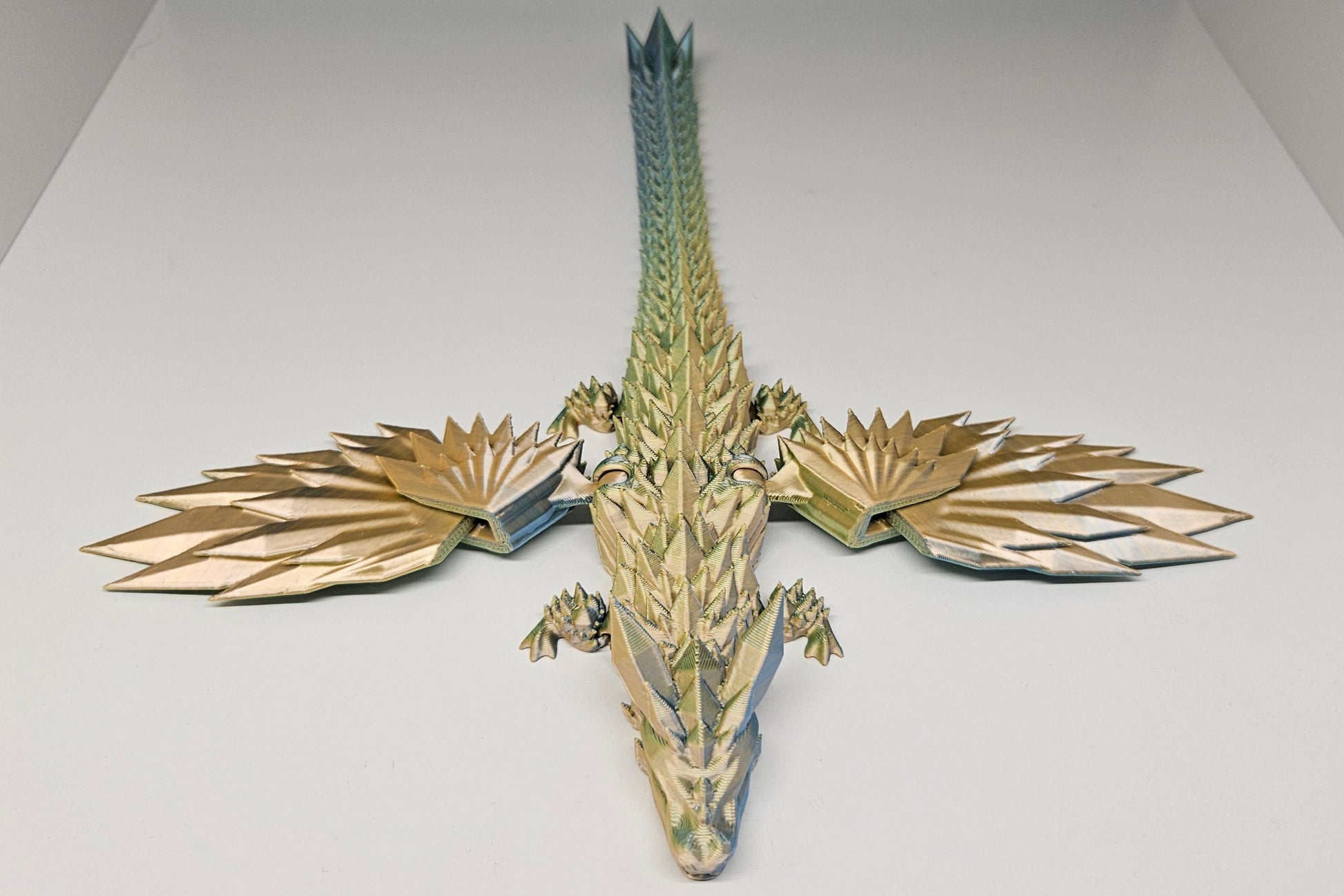 25cm 3D Printed Winged Articulated Dragon - In Gold, Green & Orange by Flexymals.co.uk