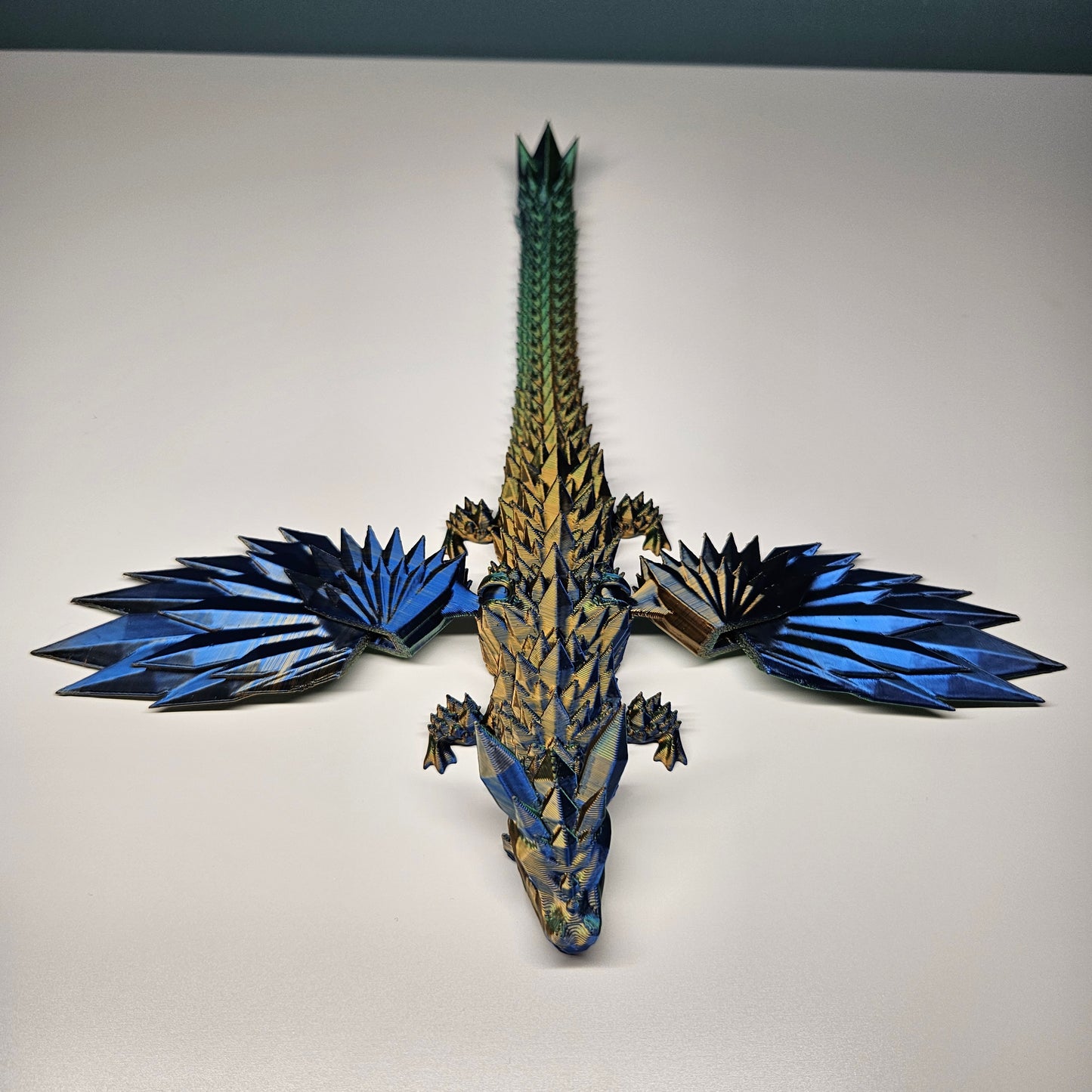 25cm 3D Printed Winged Articulated Dragon - In Gold, Blue & Green. Flexymals.co.uk