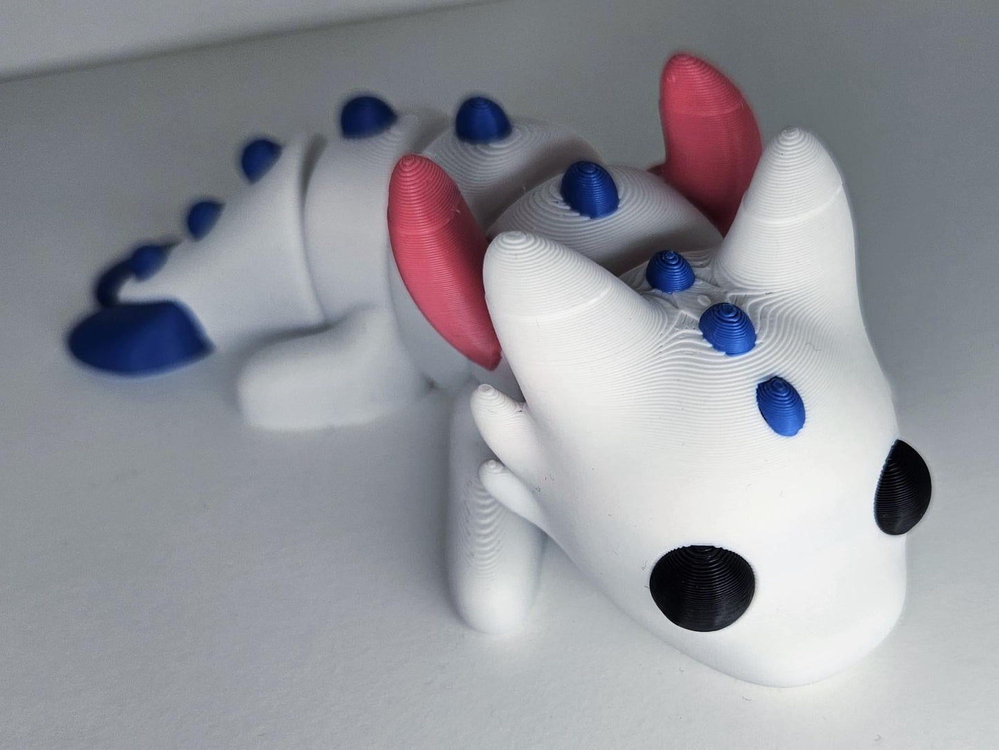 Medium Sized Flexible Dragon with Wings In White, Blue & Pink. Articulated Fidget Animal