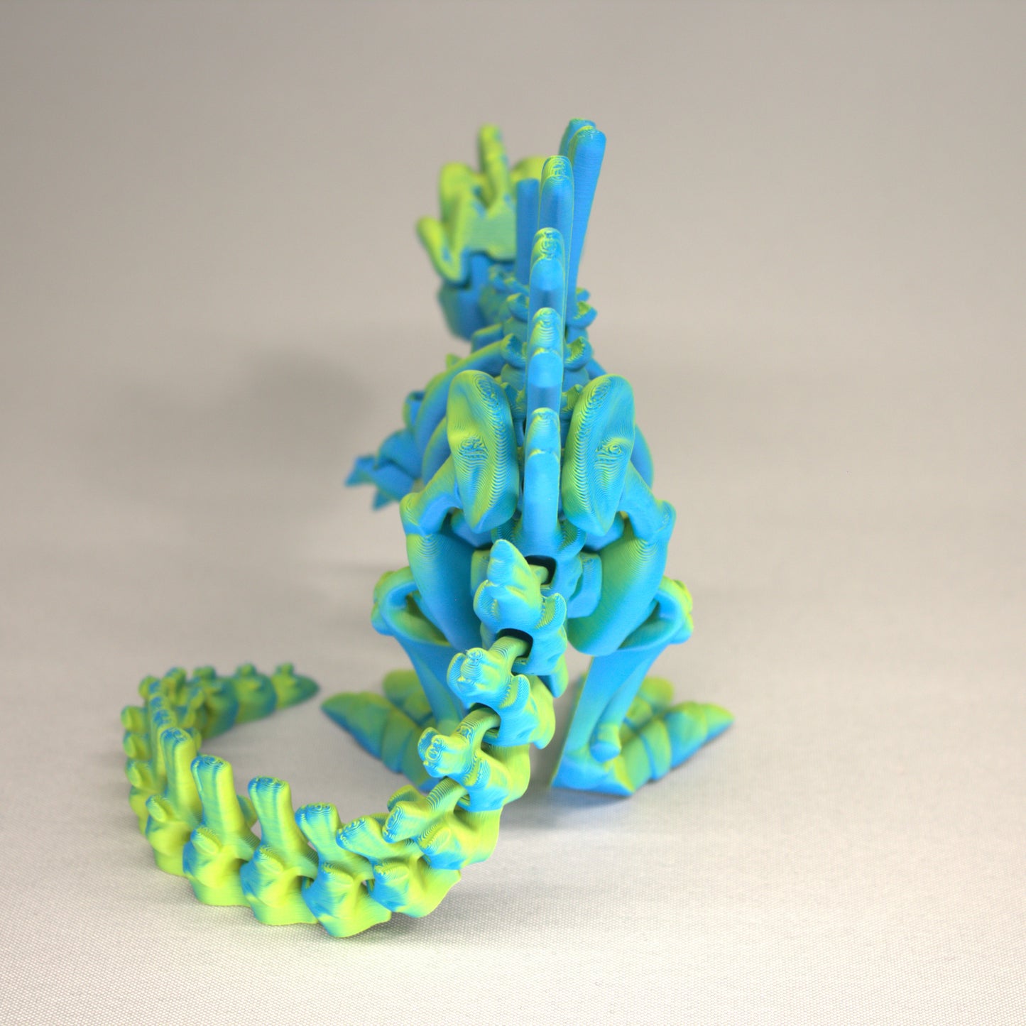 3D printed articulated Spinosaurus skeleton toy, pre-assembled, colorful, educational dinosaur figure