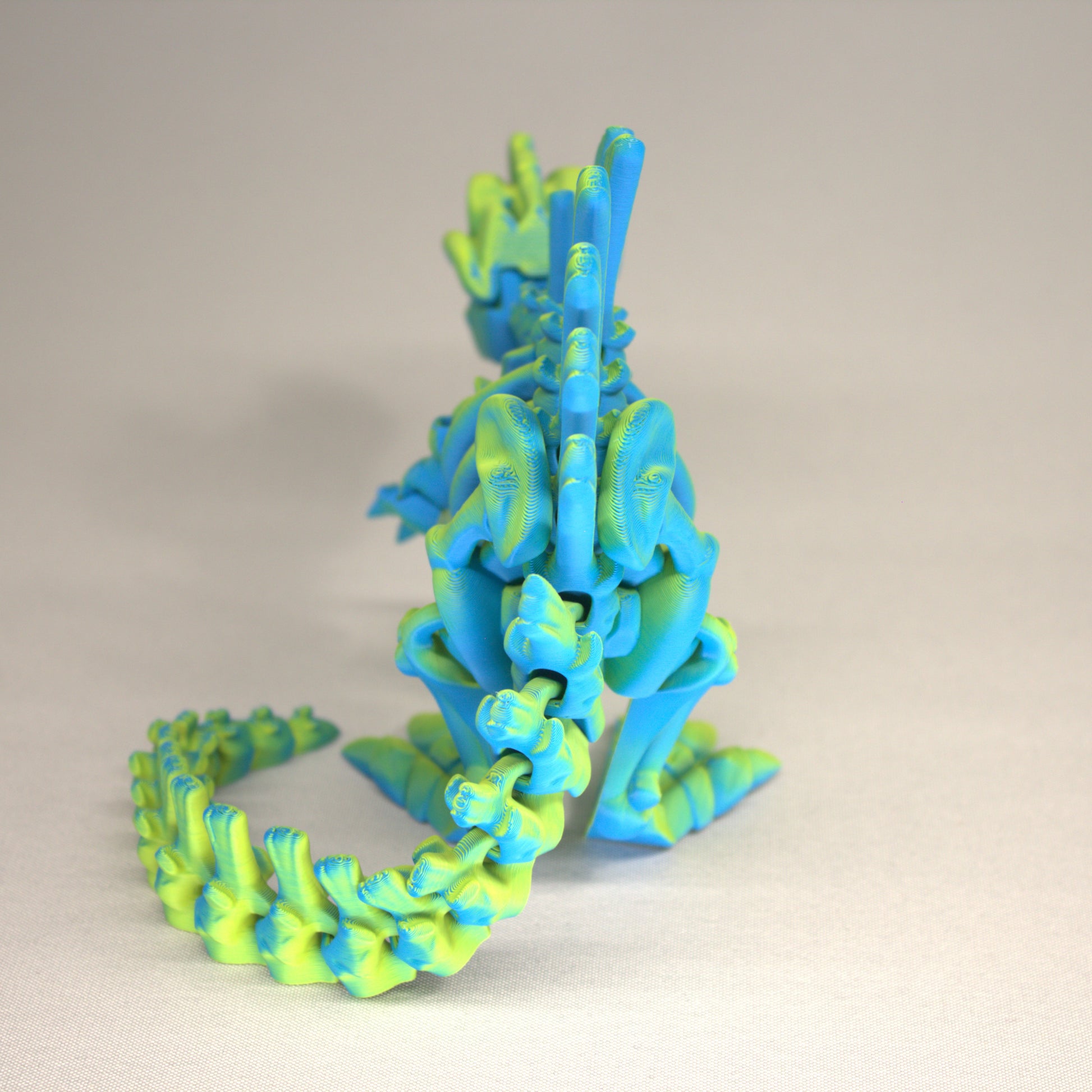 3D printed articulated Spinosaurus skeleton toy, pre-assembled, colorful, educational dinosaur figure