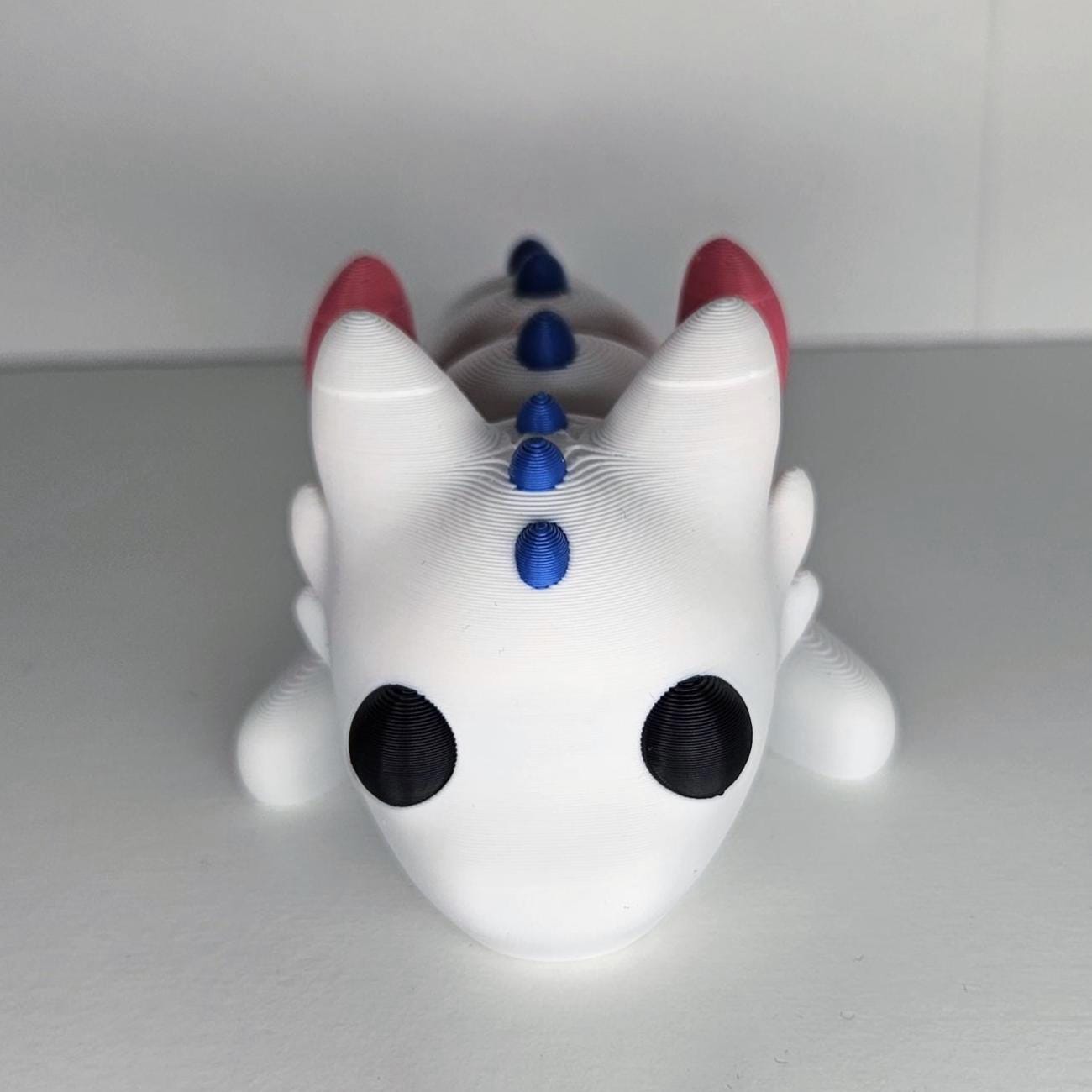 Medium Sized Flexible Dragon with Wings In White, Blue & Pink. Articulated Fidget Animal