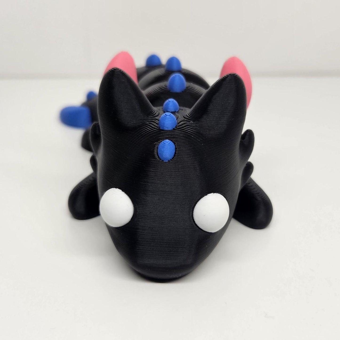12cm Flexible Dragon with Wings in Black, Pink & Blue. Articulated Fidget Animal