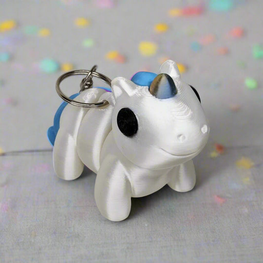 Flexible Unicorn Keyring / Key Chain in Shining White with a Gold & Blue Horn. Articulated Fidget Animal