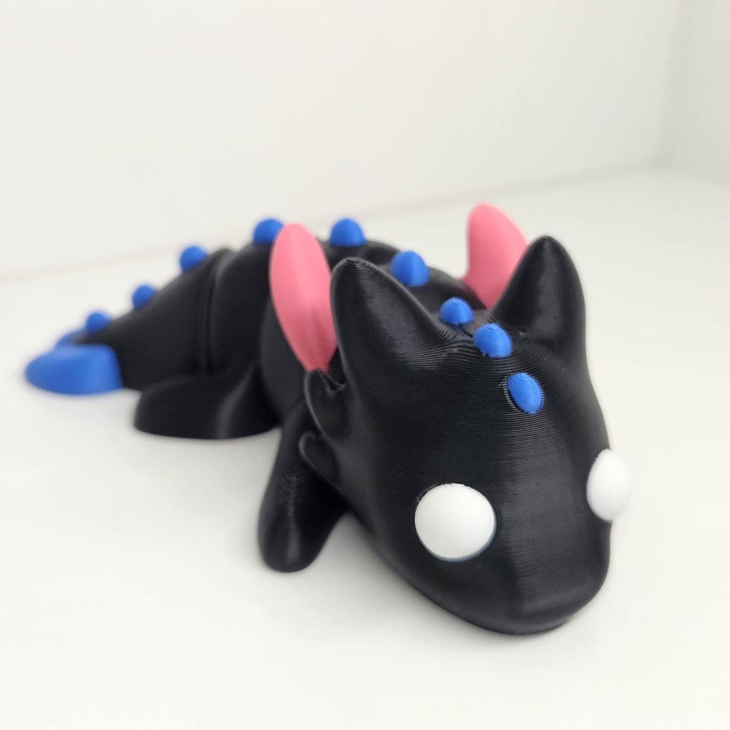 12cm Flexible Dragon with Wings in Black, Pink & Blue. Articulated Fidget Animal
