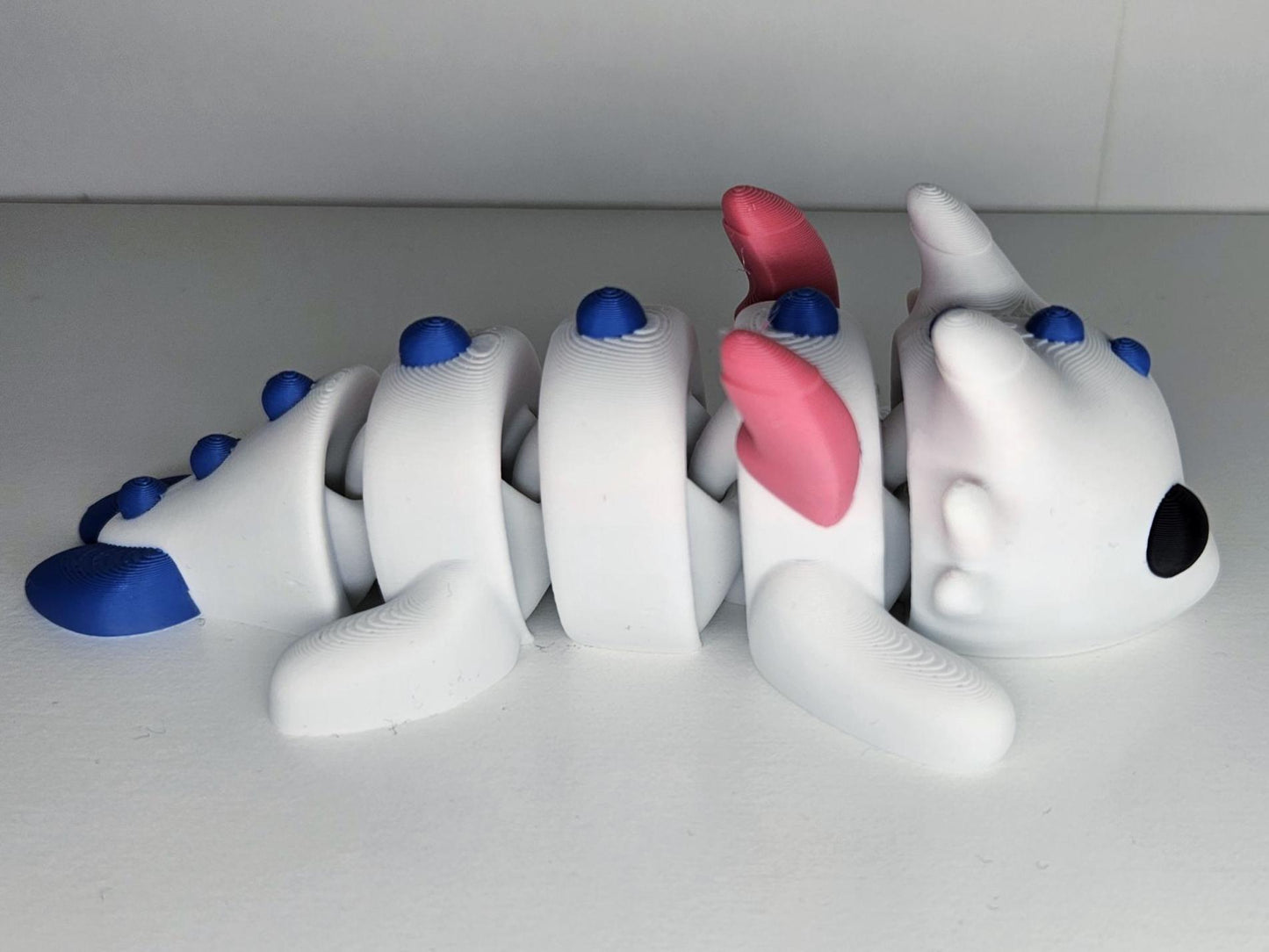 Medium Sized Flexible Dragon with Wings In White, Blue & Pink. Articulated Fidget Animal